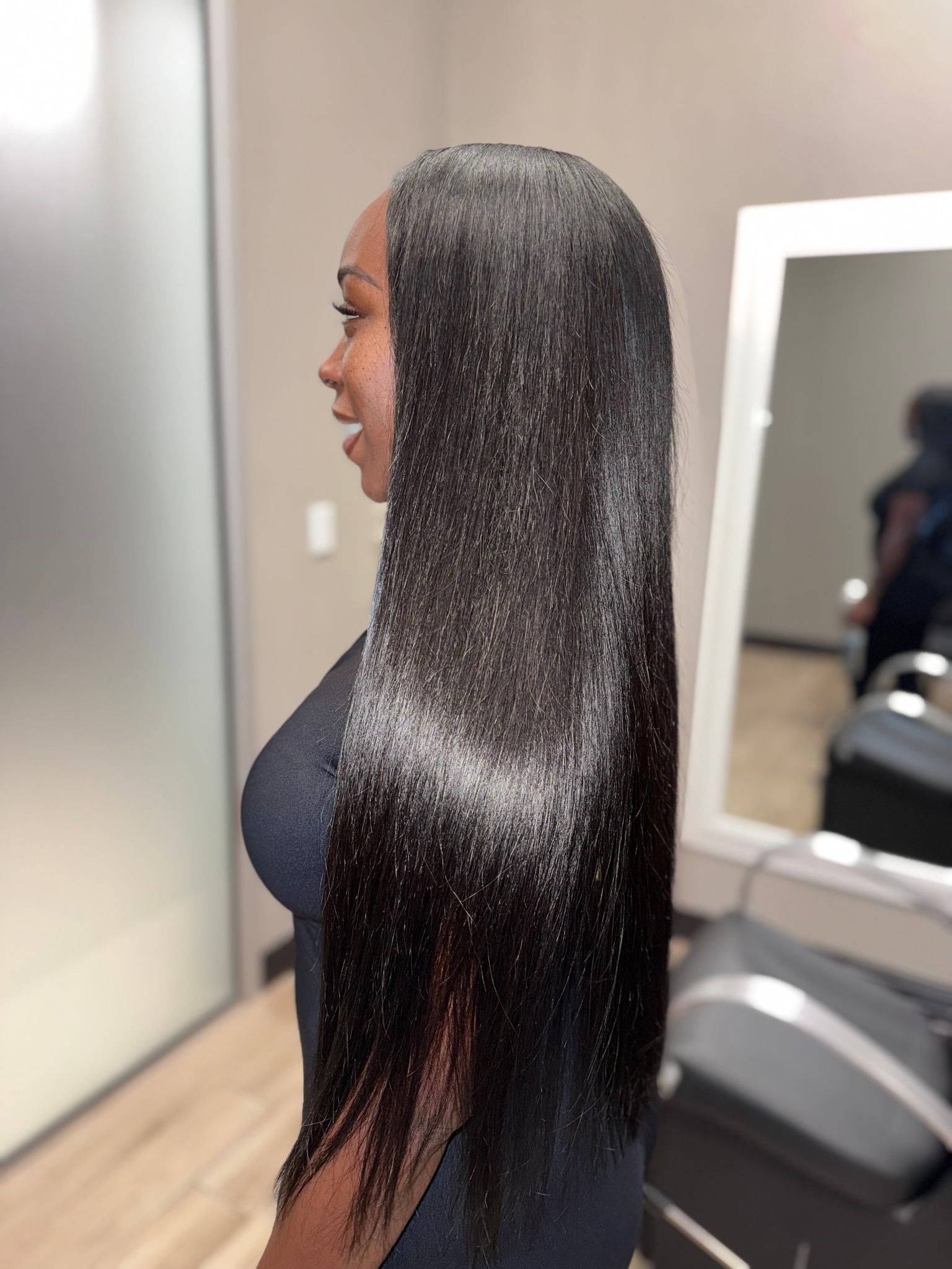 Braidless sew-in extensions side view sleek finish