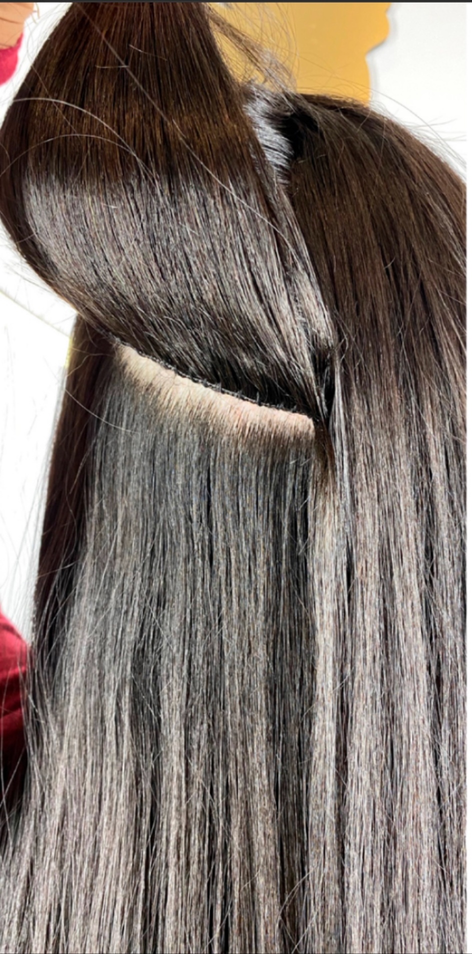 Close up of extension install showing neat weft placement